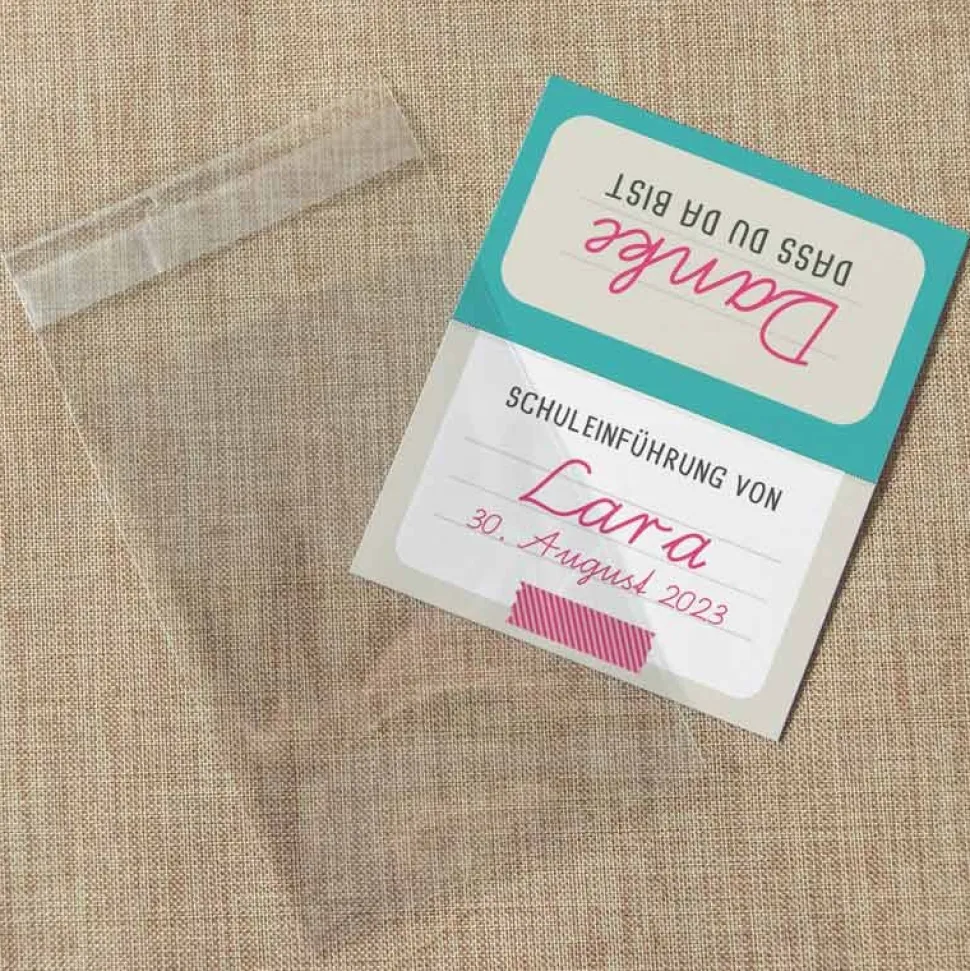 Gastgeschenk Einschulung Tüte transparent + Etikett "Schulheft"